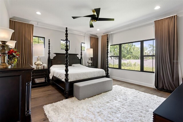 8113 Via Vittoria Way, Orlando, FL 32819 - bedroom featuring ornamental molding, dark wood-style flooring, baseboards, recessed lighting, and a ceiling fan