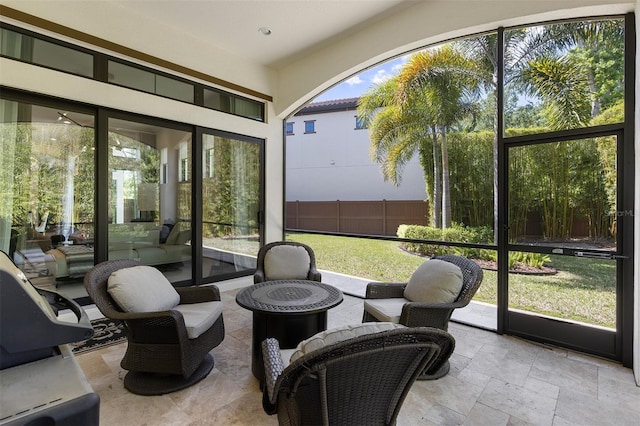 8113 Via Vittoria Way, Orlando, FL 32819 - sunroom with an outdoor fire pit and plenty of natural light