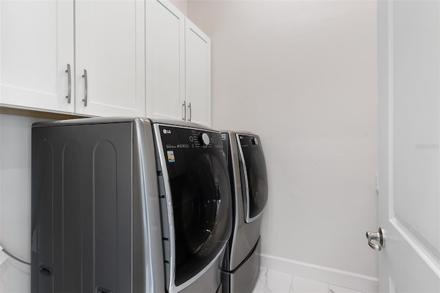 8113 Via Vittoria Way, Orlando, FL 32819 - laundry room featuring washer and dryer, cabinet space, and baseboards