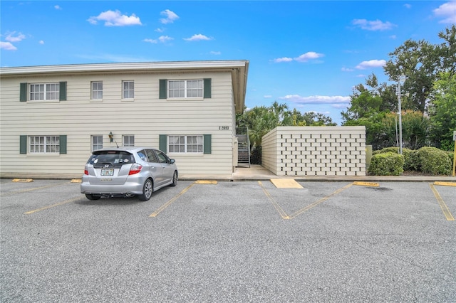 2893 S Osceola Ave Unit E6, Orlando, FL 32806 - uncovered parking lot featuring stairs