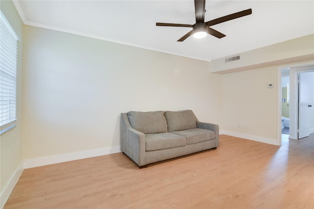 2893 S Osceola Ave Unit E6, Orlando, FL 32806 - sitting room featuring a ceiling fan, light wood-style floors, baseboards, and crown molding