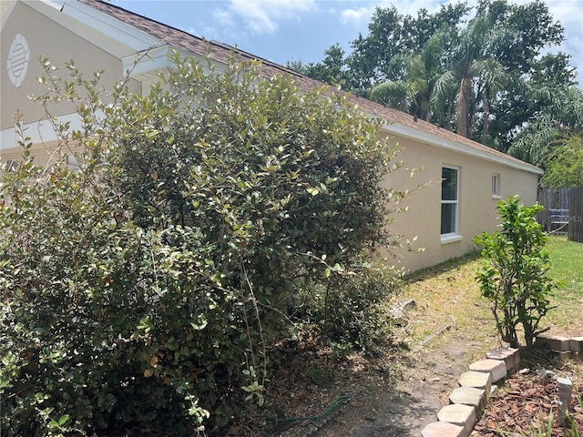 12421 Early Run Ln, Riverview, FL 33578 - view of home's exterior with stucco siding and roof with shingles