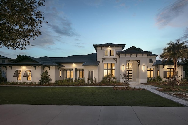 3428 Chaine Du Lac Blvd, Windermere, FL 34786 - view of front facade featuring a lawn and stucco siding