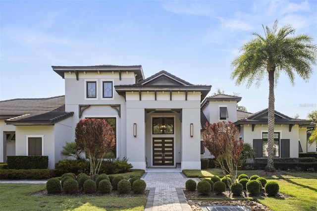 3428 Chaine Du Lac Blvd, Windermere, FL 34786 - view of front of property with stucco siding, a front yard, and a tile roof
