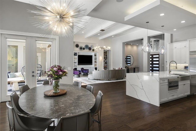 3428 Chaine Du Lac Blvd, Windermere, FL 34786 - dining area with a chandelier, beam ceiling, dark wood finished floors, recessed lighting, and french doors
