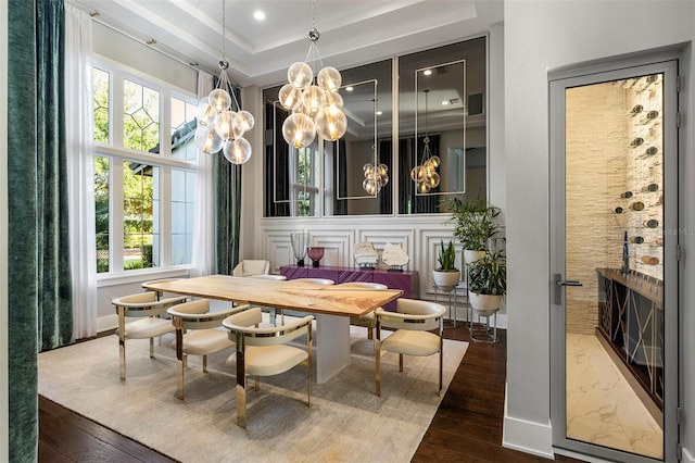 3428 Chaine Du Lac Blvd, Windermere, FL 34786 - dining area featuring a chandelier, plenty of natural light, wood finished floors, and a raised ceiling