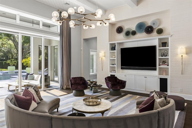 3428 Chaine Du Lac Blvd, Windermere, FL 34786 - living room featuring beam ceiling, a chandelier, wood finished floors, a towering ceiling, and built in features