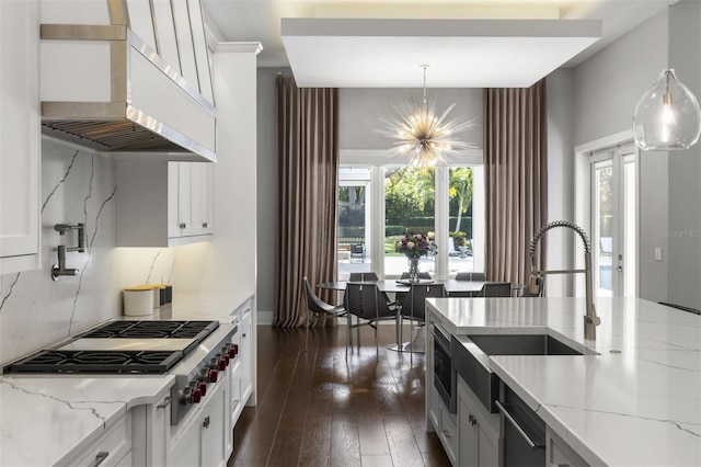 3428 Chaine Du Lac Blvd, Windermere, FL 34786 - kitchen featuring under cabinet range hood, stainless steel appliances, white cabinets, and light stone countertops