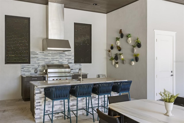 3428 Chaine Du Lac Blvd, Windermere, FL 34786 - kitchen featuring decorative backsplash, wall chimney range hood, and stove