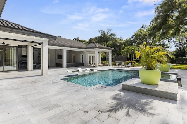 3428 Chaine Du Lac Blvd, Windermere, FL 34786 - swimming pool with a patio area and french doors