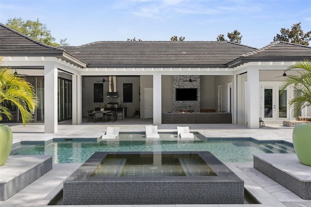 3428 Chaine Du Lac Blvd, Windermere, FL 34786 - back of property featuring french doors, stone siding, a patio, outdoor lounge area, and ceiling fan