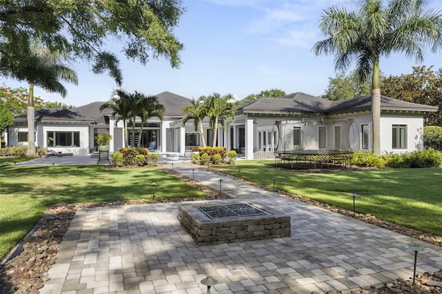 3428 Chaine Du Lac Blvd, Windermere, FL 34786 - back of property featuring an outdoor fire pit, a yard, and a patio