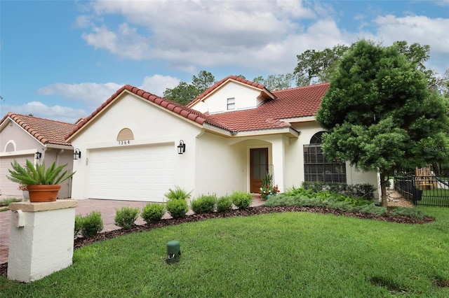 1364 Augusta National Blvd, Winter Springs, FL 32708 - mediterranean / spanish home featuring an attached garage, stucco siding, a tiled roof, and driveway