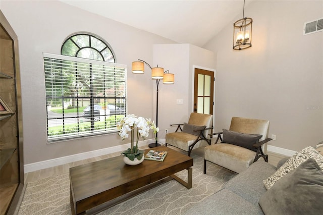 1364 Augusta National Blvd, Winter Springs, FL 32708 - living area with healthy amount of natural light, wood finished floors, baseboards, and vaulted ceiling