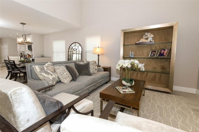 1364 Augusta National Blvd, Winter Springs, FL 32708 - living area featuring a chandelier, baseboards, and wood finished floors