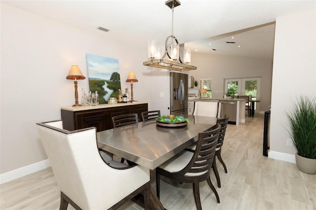 1364 Augusta National Blvd, Winter Springs, FL 32708 - dining space featuring lofted ceiling, light wood-type flooring, baseboards, a chandelier, and recessed lighting