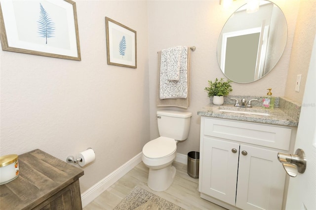 1364 Augusta National Blvd, Winter Springs, FL 32708 - half bath with vanity, toilet, baseboards, and wood finished floors