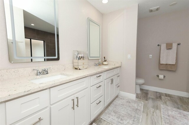 1364 Augusta National Blvd, Winter Springs, FL 32708 - full bathroom with double vanity, toilet, and baseboards