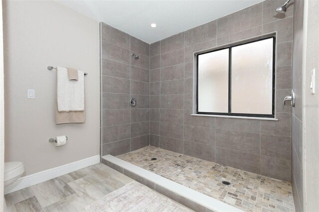 1364 Augusta National Blvd, Winter Springs, FL 32708 - bathroom with baseboards, a tile shower, toilet, and recessed lighting