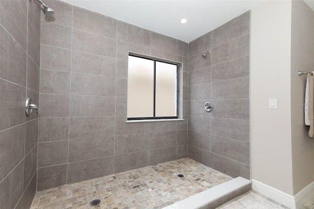 1364 Augusta National Blvd, Winter Springs, FL 32708 - bathroom featuring a tile shower, baseboards, and recessed lighting