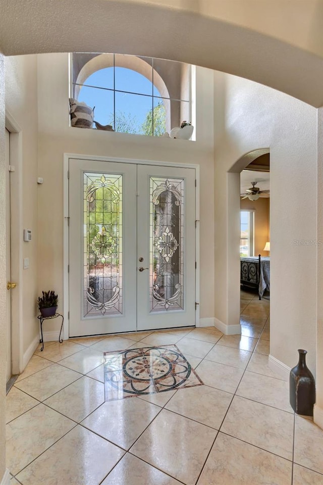 2631 Captains Ct, Kissimmee, FL 34746 - entrance foyer featuring tile patterned flooring, french doors, a towering ceiling, and ceiling fan