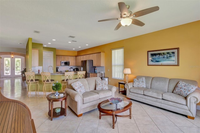 2631 Captains Ct, Kissimmee, FL 34746 - living area featuring french doors, light tile patterned flooring, a ceiling fan, and recessed lighting