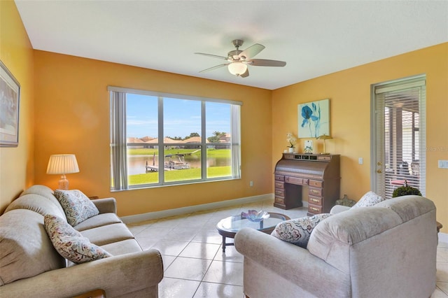 2631 Captains Ct, Kissimmee, FL 34746 - living room with light tile patterned flooring and a ceiling fan