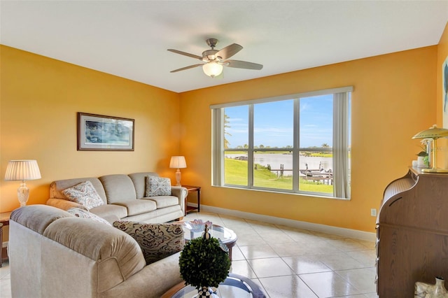 2631 Captains Ct, Kissimmee, FL 34746 - living room featuring a water view, a ceiling fan, and light tile patterned flooring