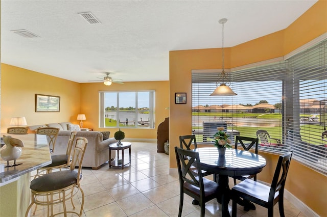 2631 Captains Ct, Kissimmee, FL 34746 - dining room with ceiling fan and light tile patterned floors