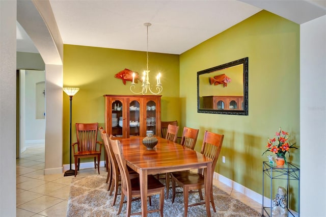 2631 Captains Ct, Kissimmee, FL 34746 - tiled dining room featuring a chandelier and baseboards