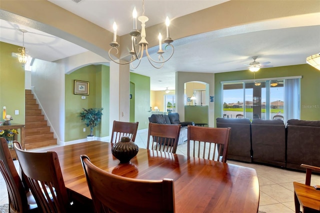 2631 Captains Ct, Kissimmee, FL 34746 - dining area with arched walkways, a ceiling fan, light tile patterned floors, and a chandelier