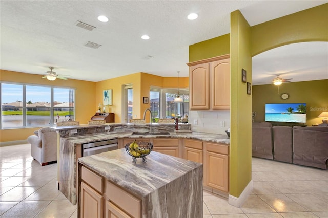 2631 Captains Ct, Kissimmee, FL 34746 - kitchen with a ceiling fan, light brown cabinets, open floor plan, recessed lighting, and a textured ceiling