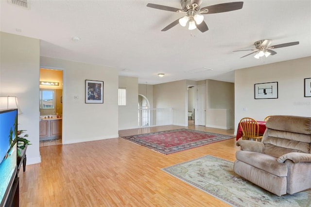 2631 Captains Ct, Kissimmee, FL 34746 - living room with light wood-type flooring and ceiling fan
