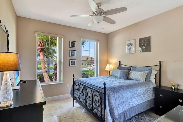 2631 Captains Ct, Kissimmee, FL 34746 - bedroom with light tile patterned floors and a ceiling fan