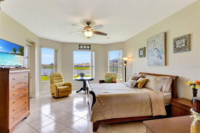 2631 Captains Ct, Kissimmee, FL 34746 - bedroom with light tile patterned floors and a ceiling fan