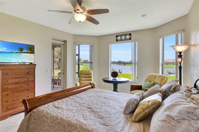 2631 Captains Ct, Kissimmee, FL 34746 - bedroom with access to exterior, a water view, multiple windows, and ceiling fan
