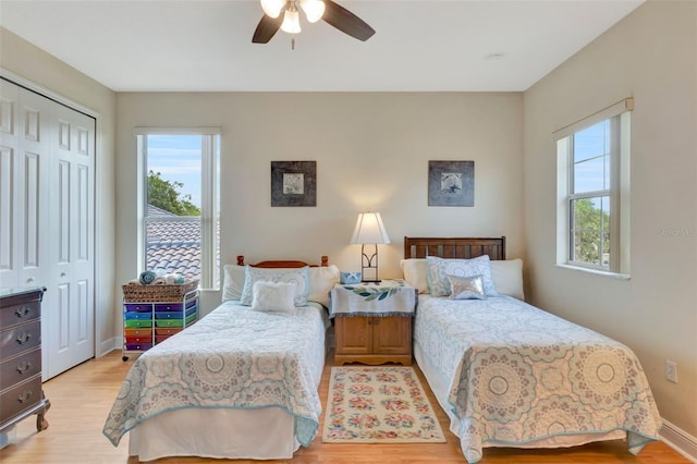 2631 Captains Ct, Kissimmee, FL 34746 - bedroom with a closet, light wood-type flooring, and a ceiling fan