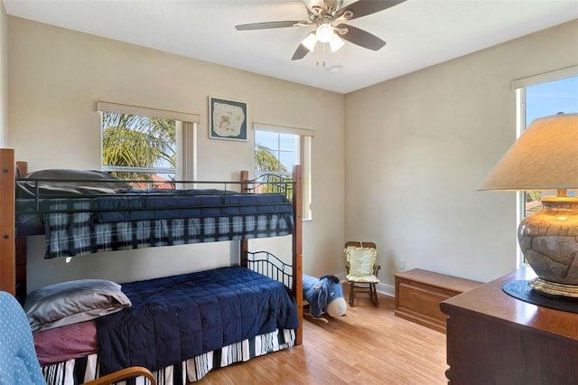 2631 Captains Ct, Kissimmee, FL 34746 - bedroom with light wood-type flooring and ceiling fan