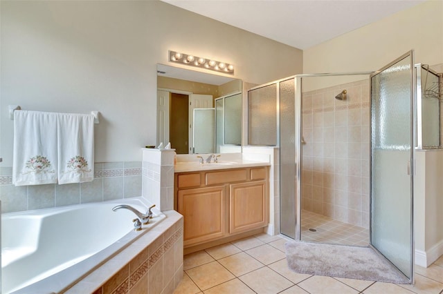 2631 Captains Ct, Kissimmee, FL 34746 - bathroom featuring a shower stall, vanity, a bath, and tile patterned flooring