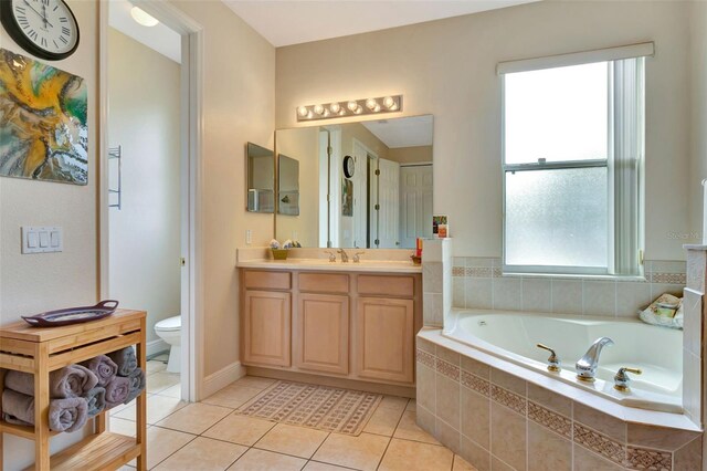 2631 Captains Ct, Kissimmee, FL 34746 - full bathroom featuring a garden tub, vanity, and tile patterned floors