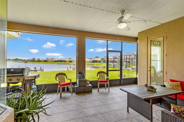 2631 Captains Ct, Kissimmee, FL 34746 - sunroom / solarium with a textured wall, a water view, ceiling fan, and a residential view