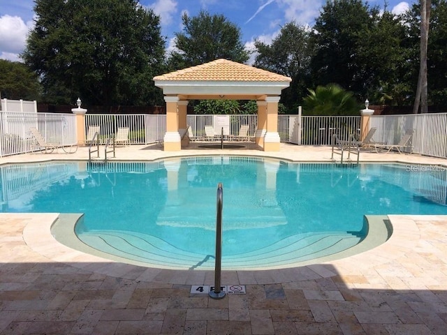 13512 Turtle Marsh Loop Unit 729, Orlando, FL 32837 - community pool featuring a gazebo and a patio