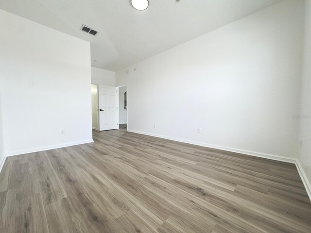 13512 Turtle Marsh Loop Unit 729, Orlando, FL 32837 - empty room with baseboards and wood finished floors