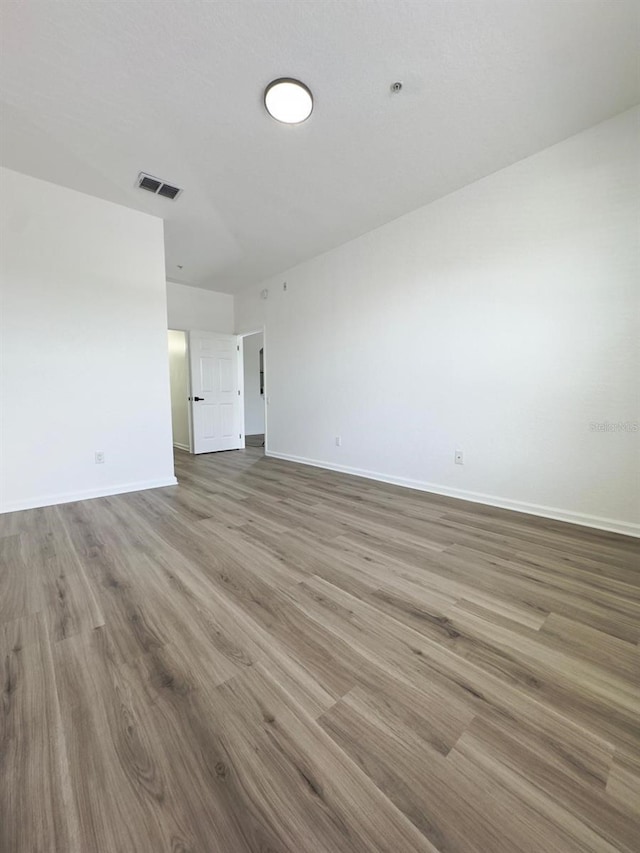 13512 Turtle Marsh Loop Unit 729, Orlando, FL 32837 - unfurnished living room featuring baseboards and wood finished floors