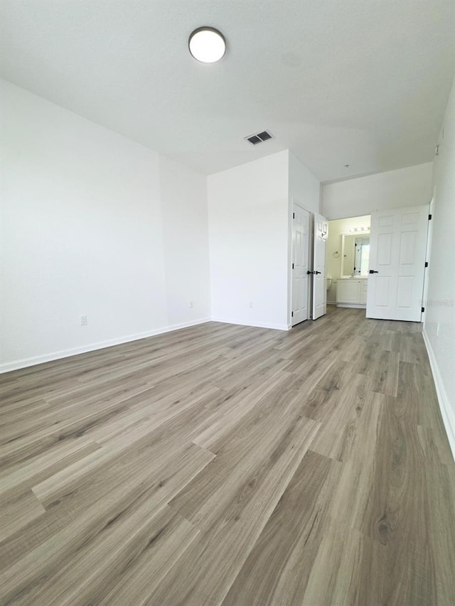 13512 Turtle Marsh Loop Unit 729, Orlando, FL 32837 - unfurnished living room featuring light wood-type flooring and baseboards