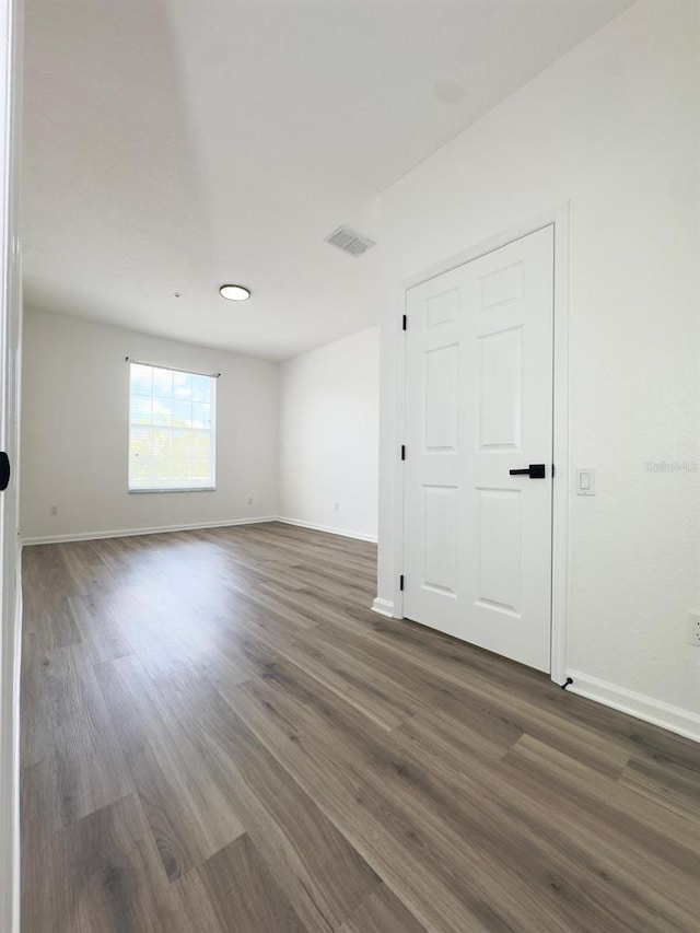 13512 Turtle Marsh Loop Unit 729, Orlando, FL 32837 - empty room featuring baseboards and dark wood-type flooring