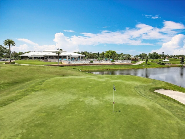 3944 Atrium Dr Unit 4, Orlando, FL 32822 - surrounding community with a water view, view of golf course, an area to practice putting, and a yard