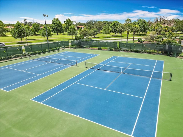 3944 Atrium Dr Unit 4, Orlando, FL 32822 - view of tennis court with community basketball court and view of wooded area