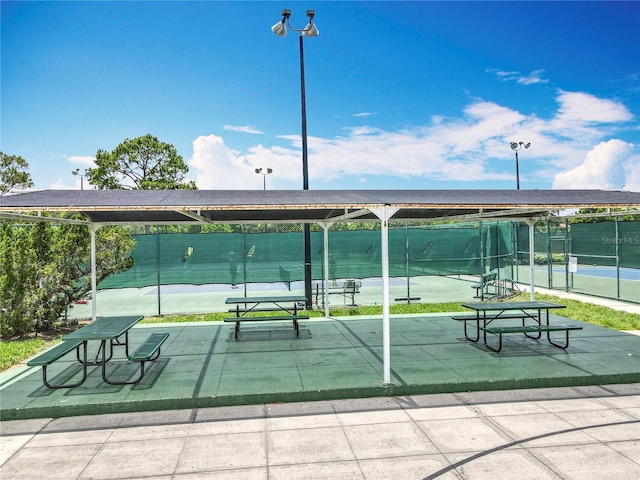 3944 Atrium Dr Unit 4, Orlando, FL 32822 - view of home's community featuring a tennis court