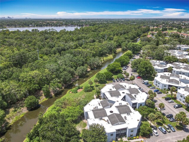 3944 Atrium Dr Unit 4, Orlando, FL 32822 - drone / aerial view of a heavily wooded area and a large body of water